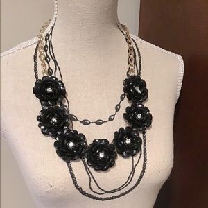 Black Acrylic Flowers With A Rhinestone Center In Each